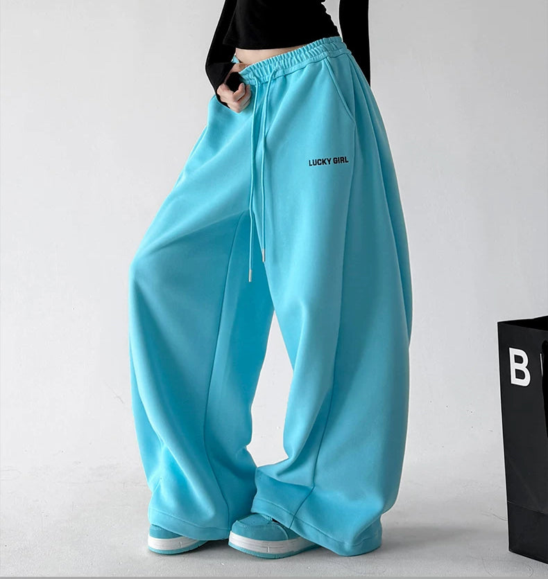 ct66252 letter print wide leg sweatpants blue angled front 23 edgefix focus v2