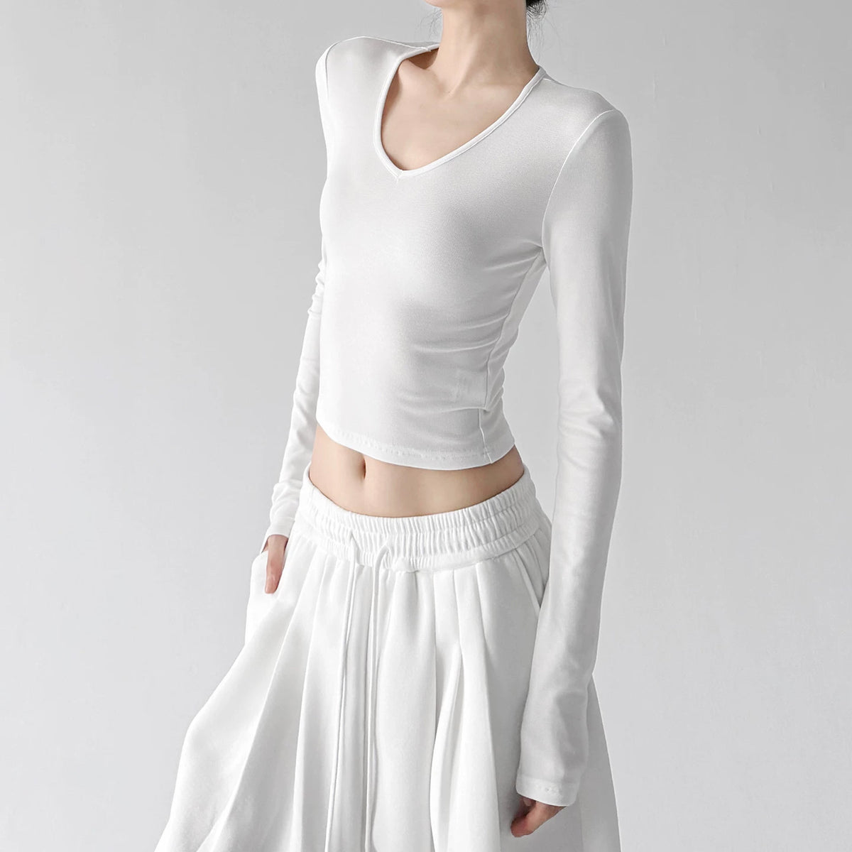 White v neck crop top, angled front view