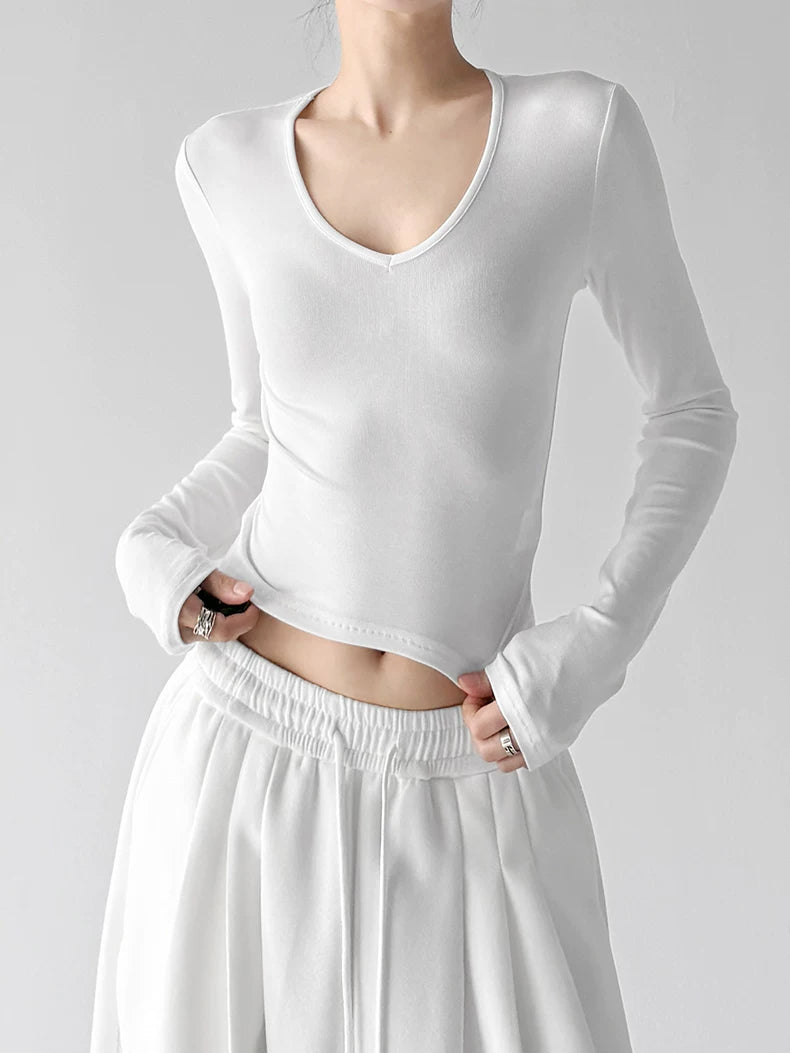 White v neck crop top, front hands view
