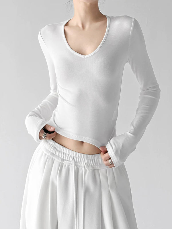 White v neck crop top, front hands view