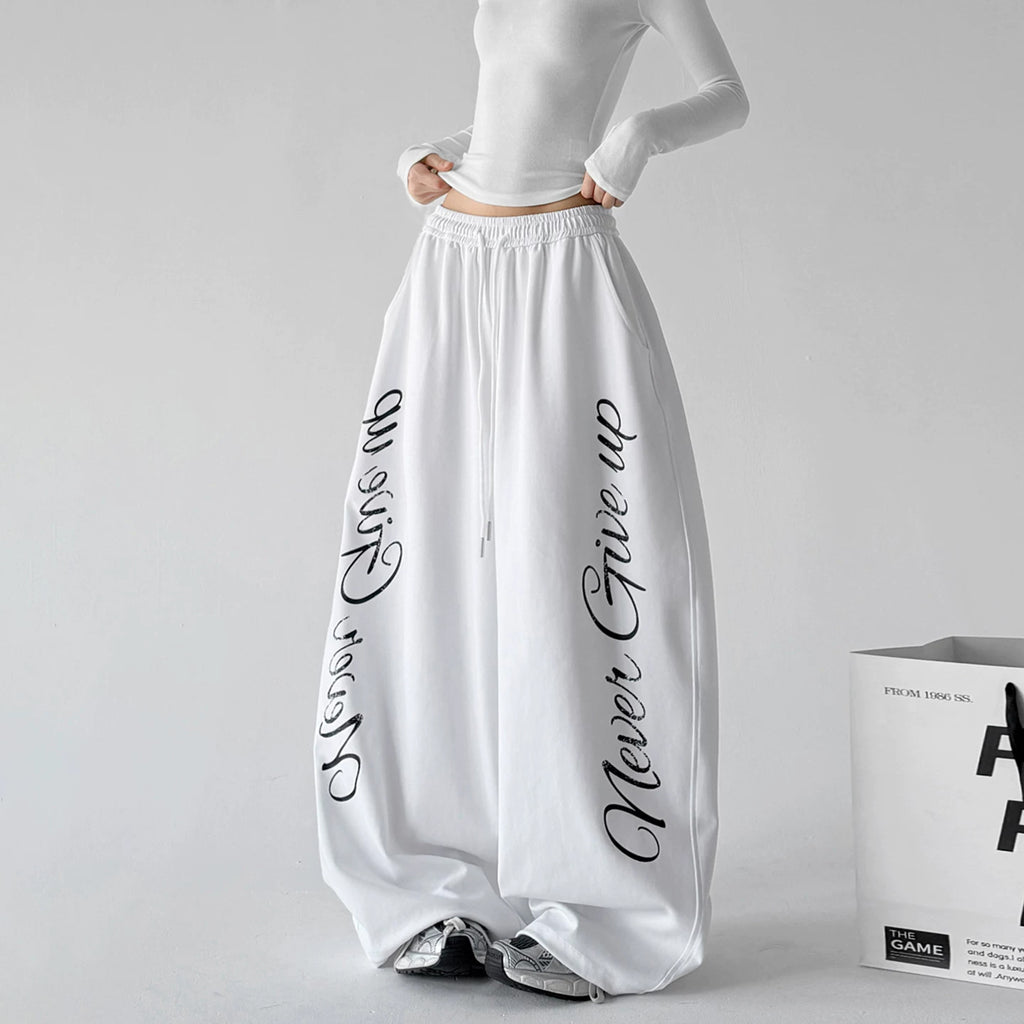 White wide leg pants, front hands view