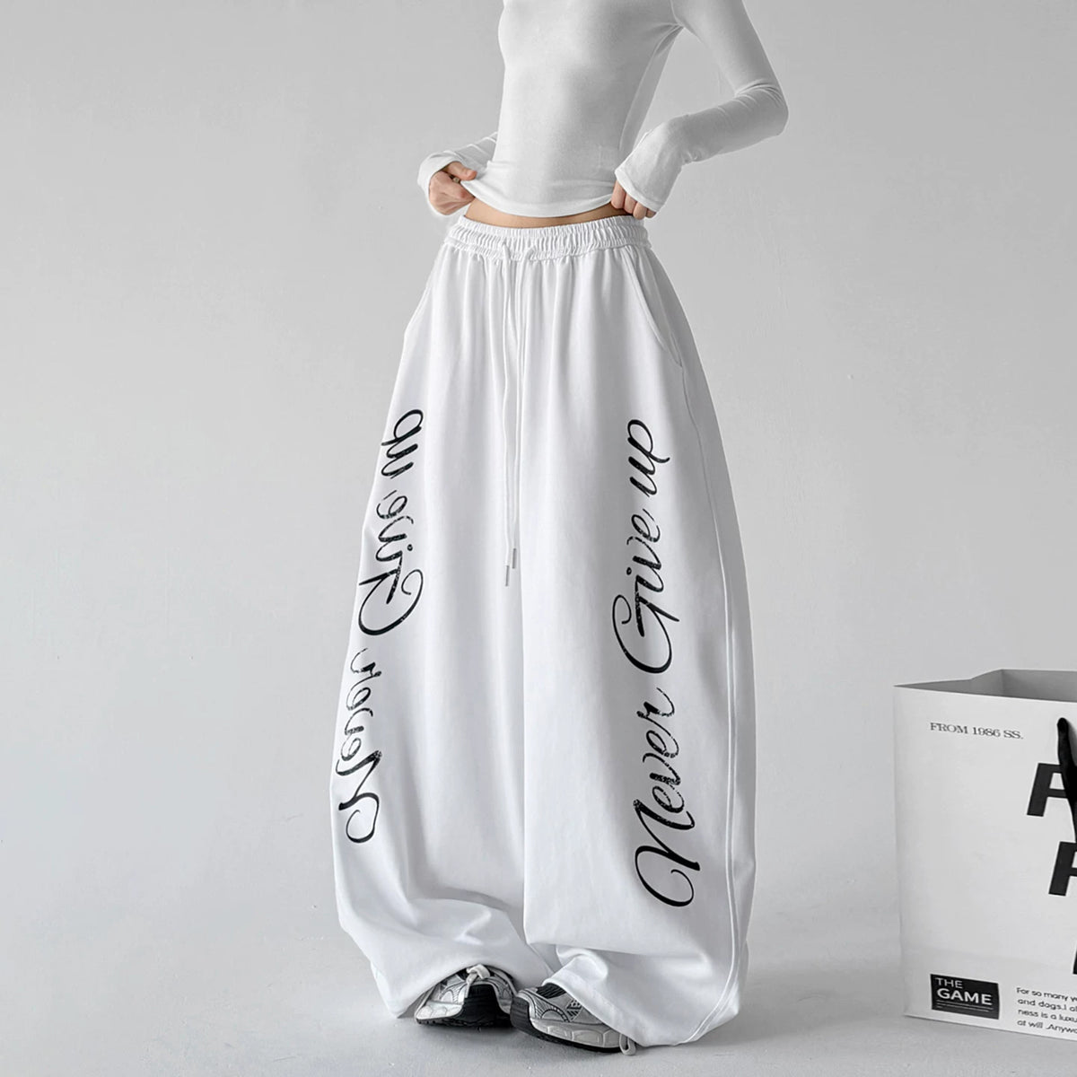 White wide leg pants, front hands view