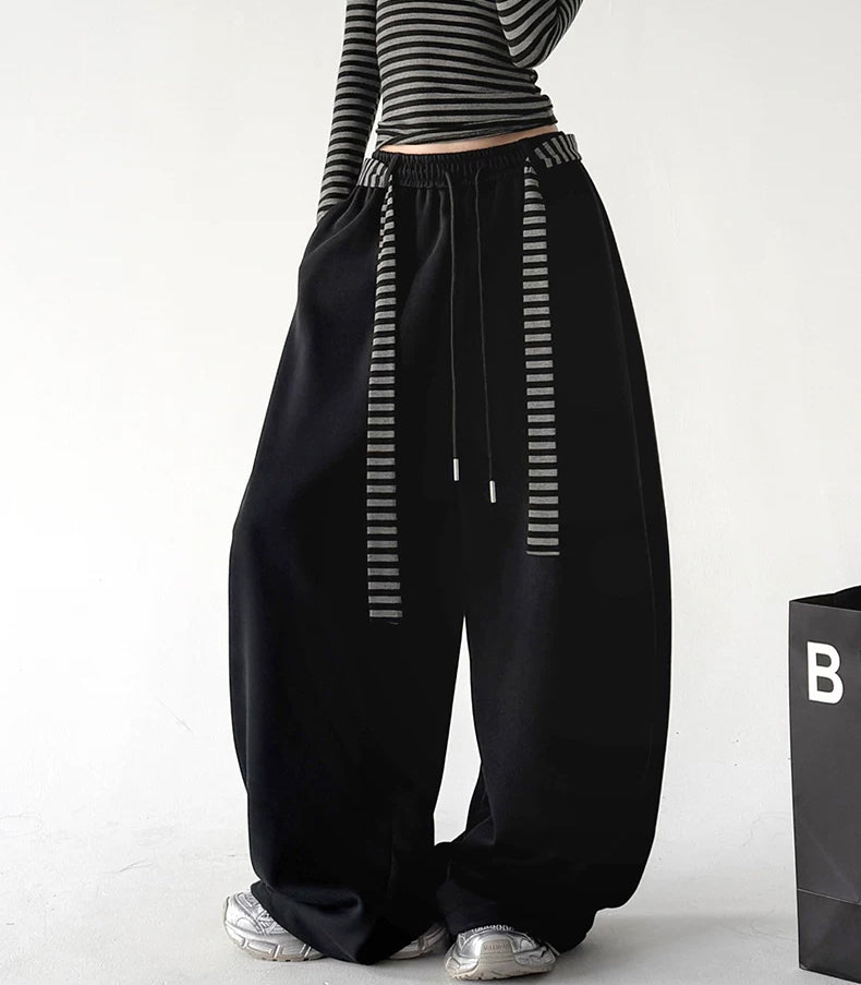 Black striped tie wide leg pants, front view