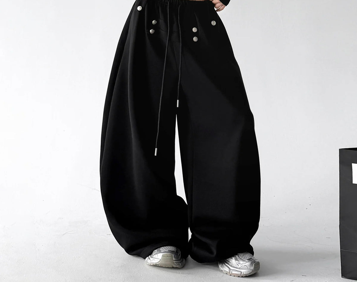 Black decorative-button wide-leg pants front hands - CT66292