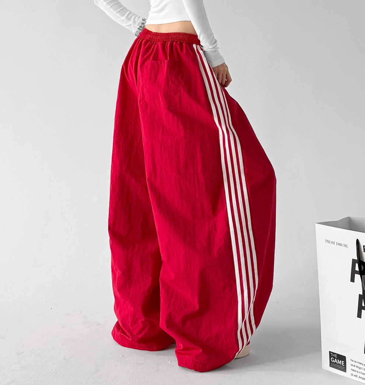 Red side-stripe wide-leg pants angled back - CT66303