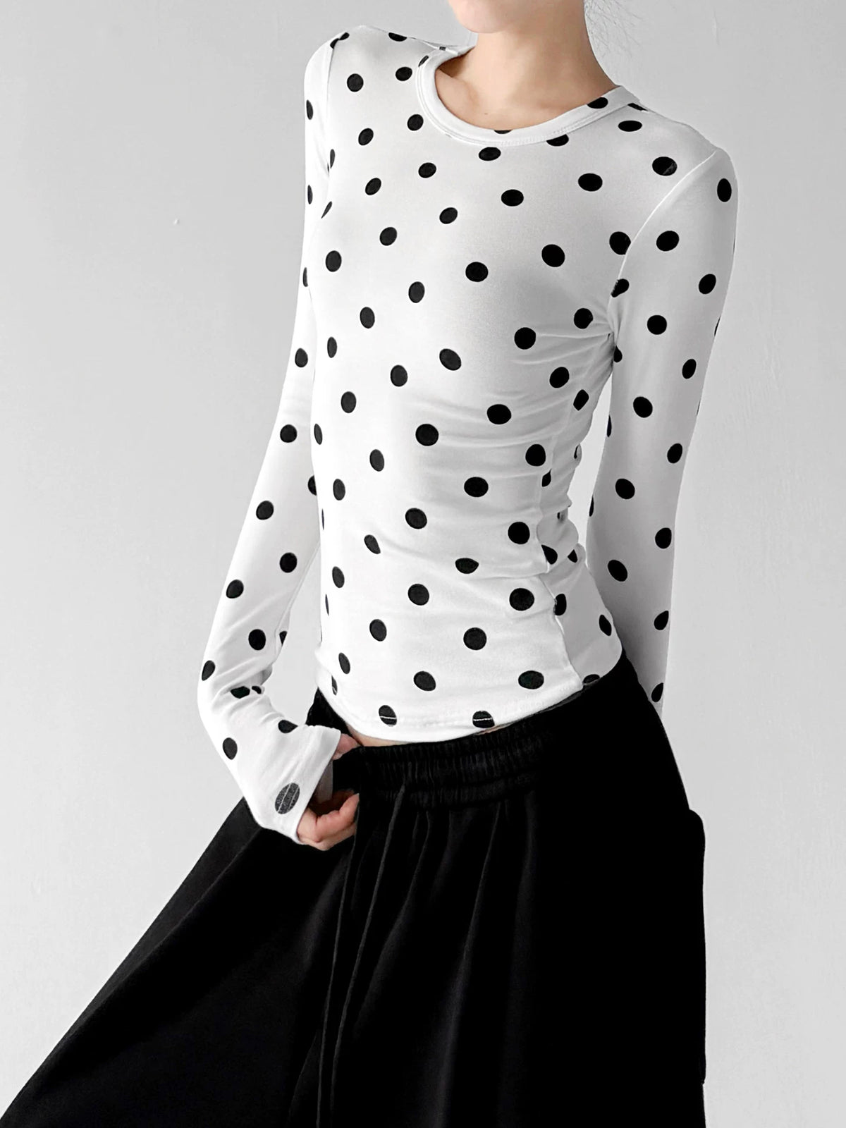 White polka-dot long-sleeve top angled front - CT66327