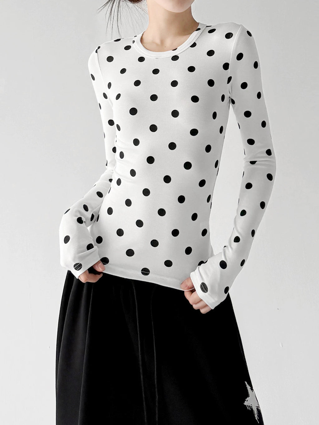 White polka-dot long-sleeve top front hands - CT66327