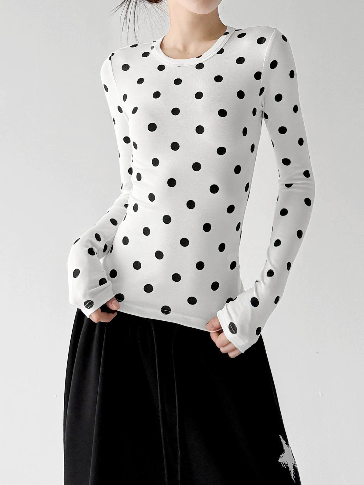 White polka-dot long-sleeve top front hands - CT66327