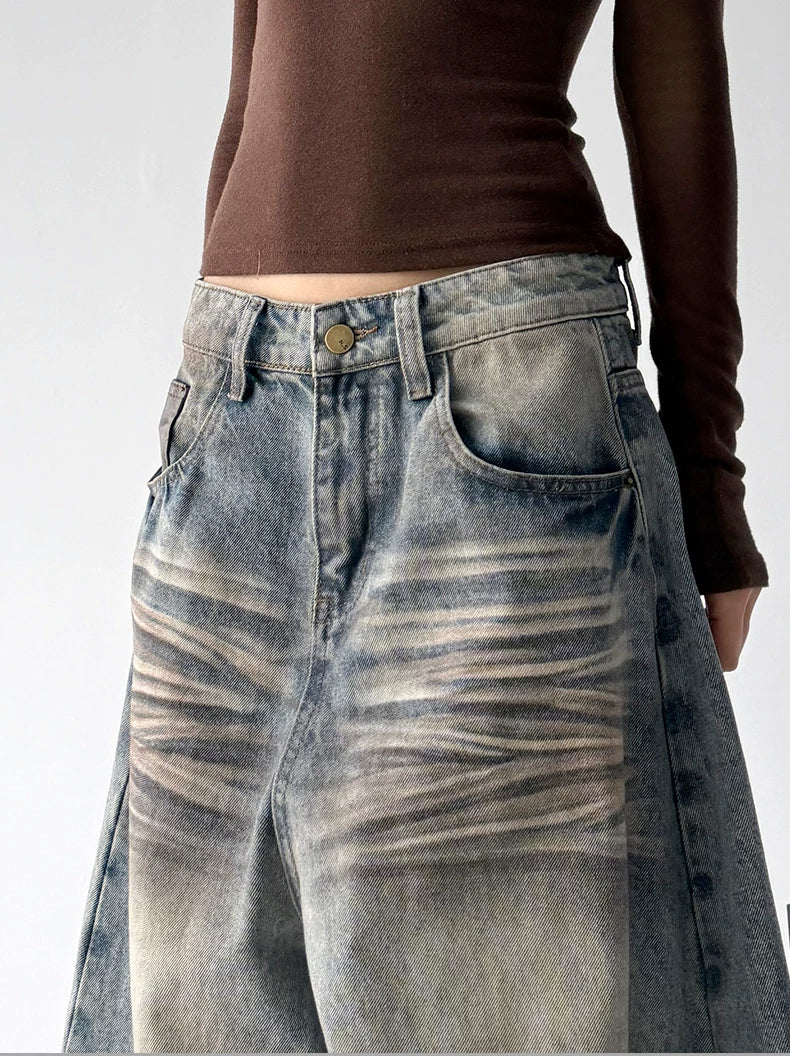 Blue washed wide leg jeans, waist detail view