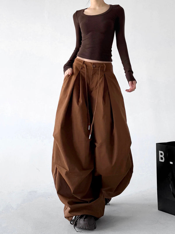 Caramel pleated baggy pants walking view - CT822