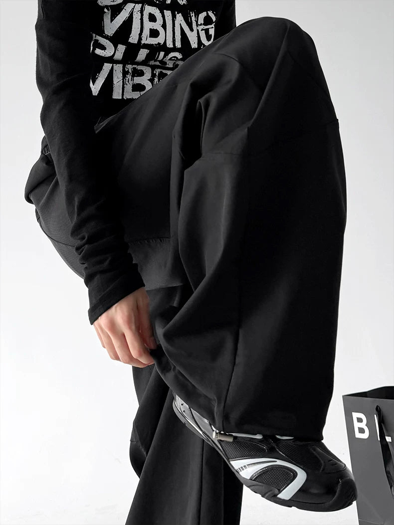 Black cuff detail view of wide-leg pants