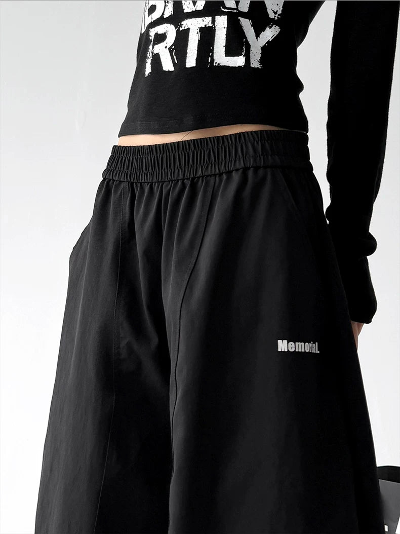 Black waist detail view of wide-leg pants