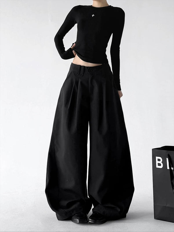 Black wide-leg pants, front hands view