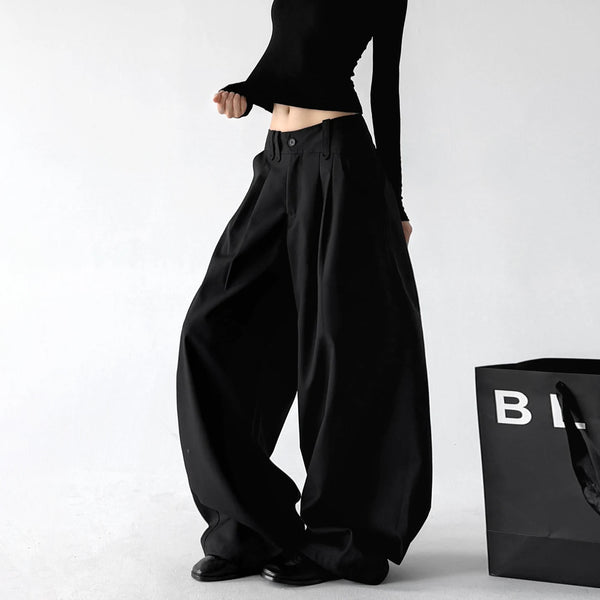 Black double pleat wide leg pants, angled front view