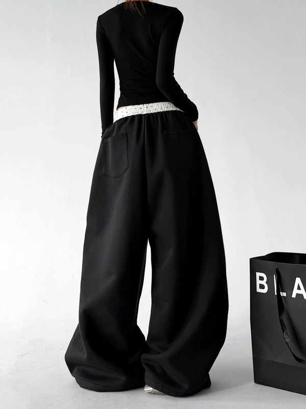 Black contrast waist wide leg pants, back view