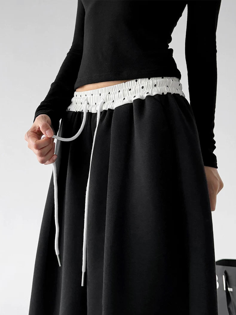 Black contrast waist wide leg pants, waist detail view
