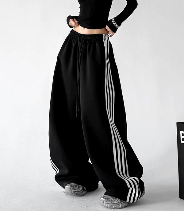 Black wide leg pants, front hands view