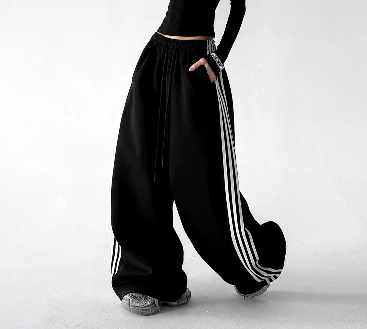 Black wide leg pants, side step view