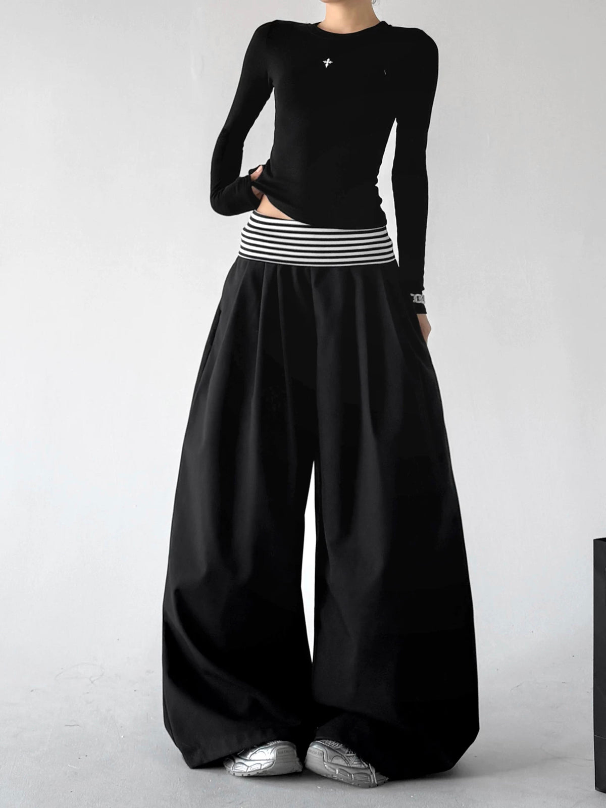 Black wide leg pants, angled front view