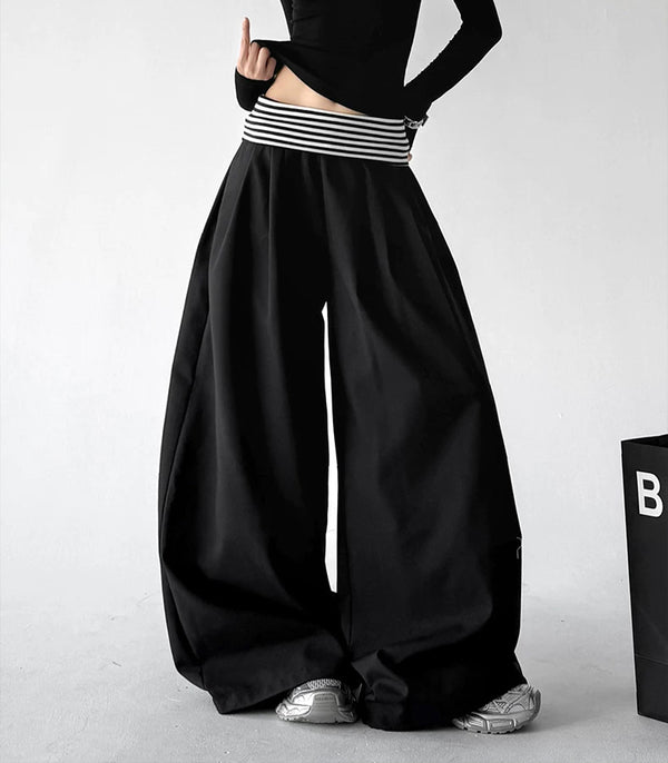 Black wide leg pants, front hands view