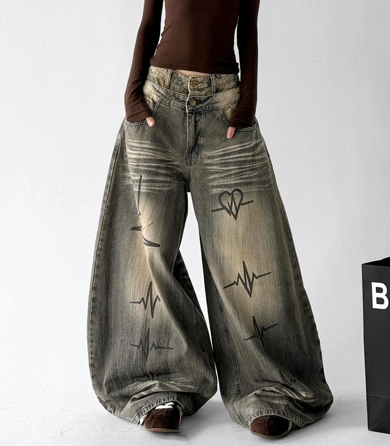 Gray graphic washed jeans, angled front view