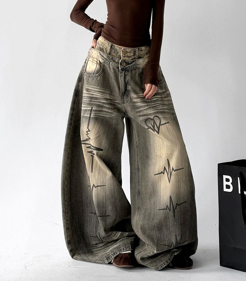 Gray graphic washed jeans, front hands view