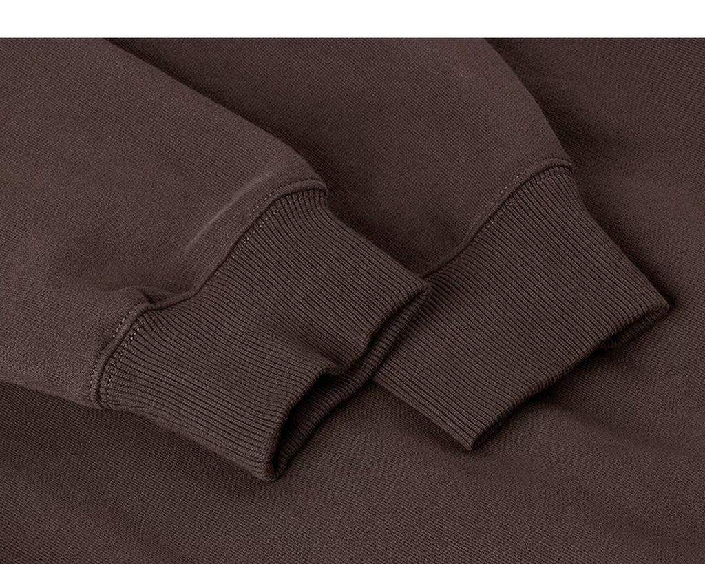 IDLT sweatshirt, brown ribbed cuffs.
