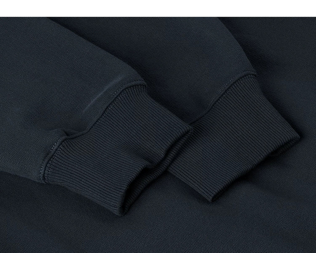 IDLT sweatshirt, navy ribbed cuffs.