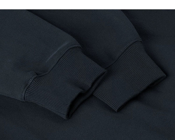 IDLT sweatshirt, navy ribbed cuffs.