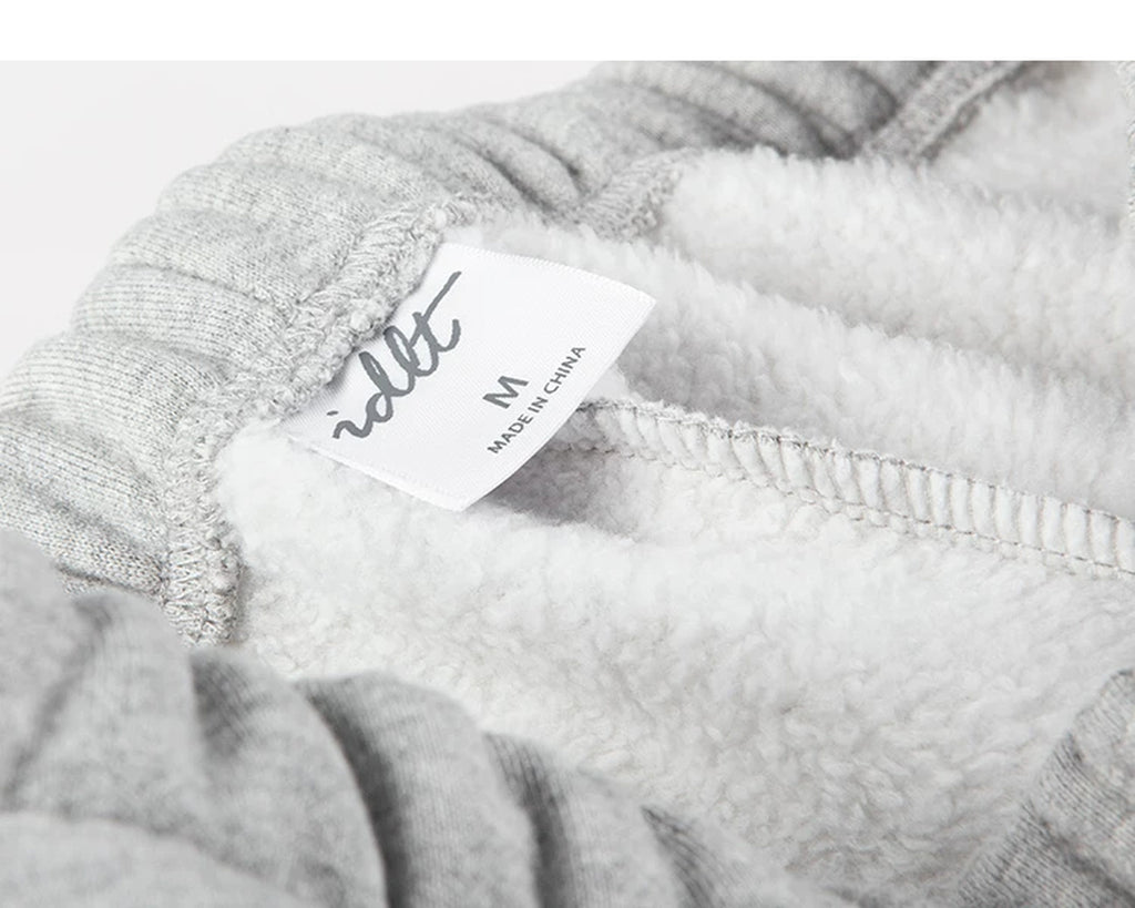 IDLT joggers, heather gray inner waistband label.