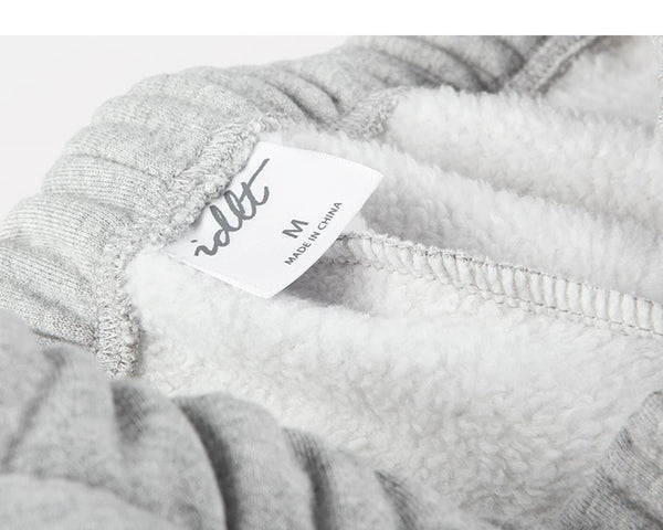 IDLT joggers, heather gray inner waistband label.