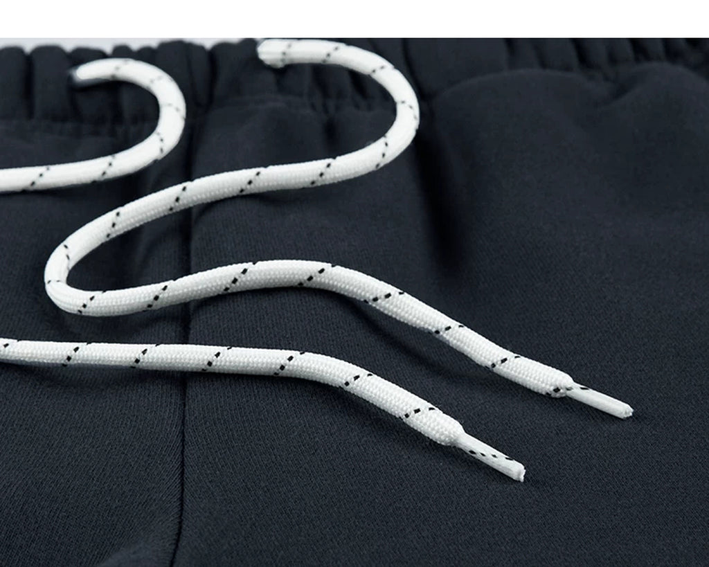 IDLT joggers, navy drawstring close-up.