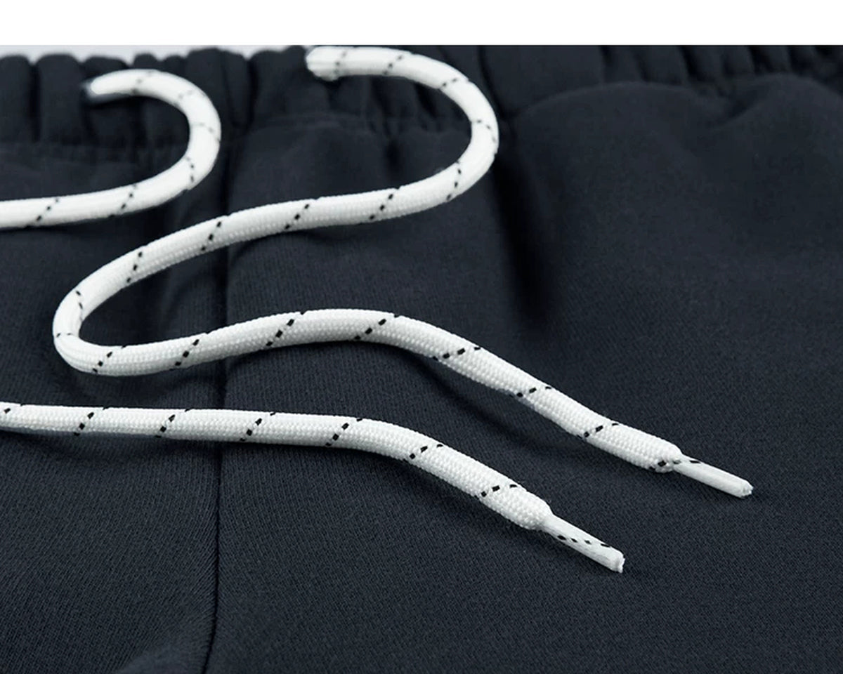 IDLT joggers, navy drawstring close-up.