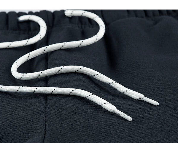 IDLT joggers, navy drawstring close-up.