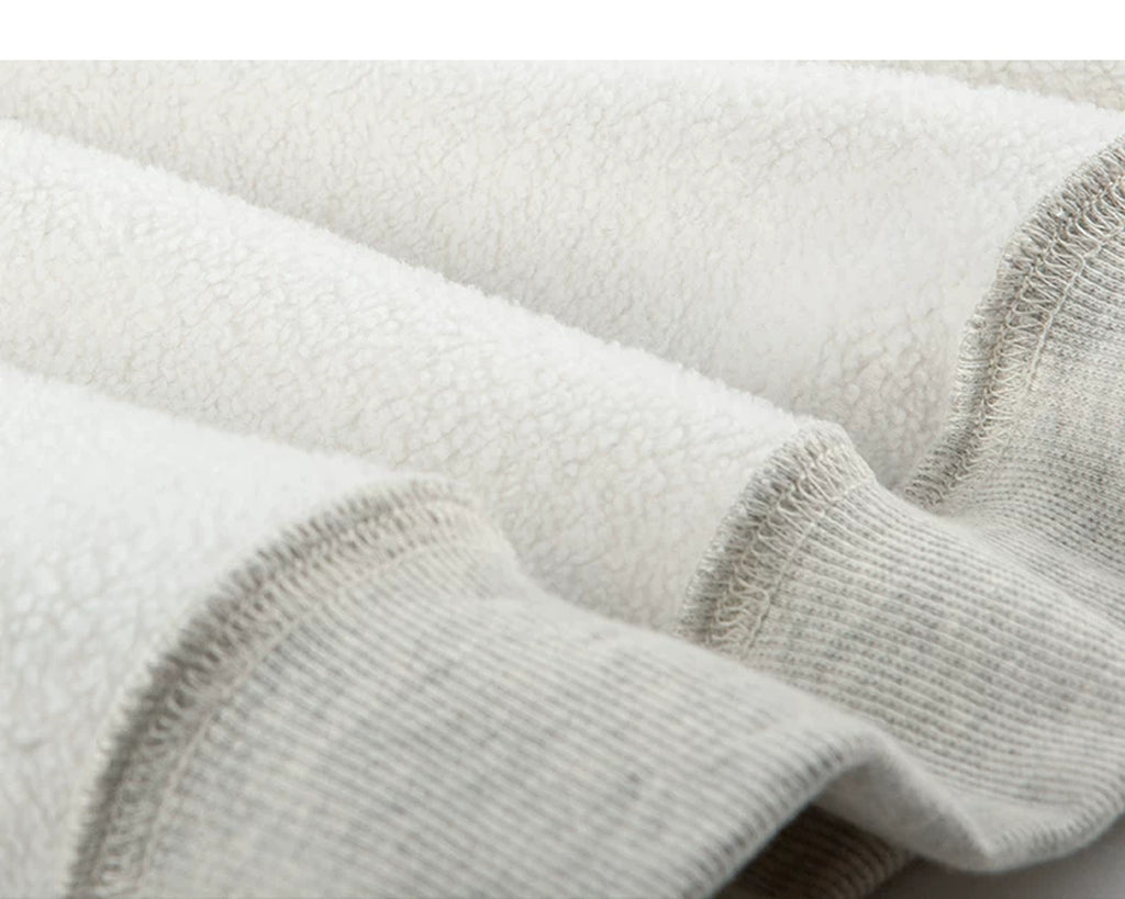 IDLT sweatshirt, cream fleece texture and ribbing.