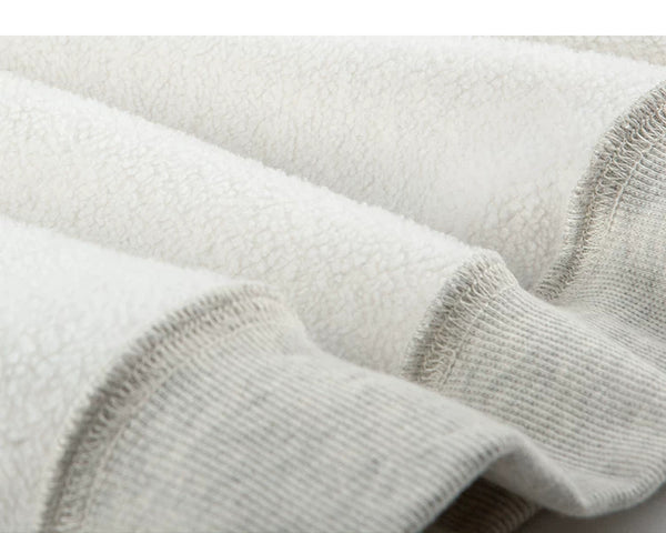 IDLT sweatshirt, cream fleece texture and ribbing.