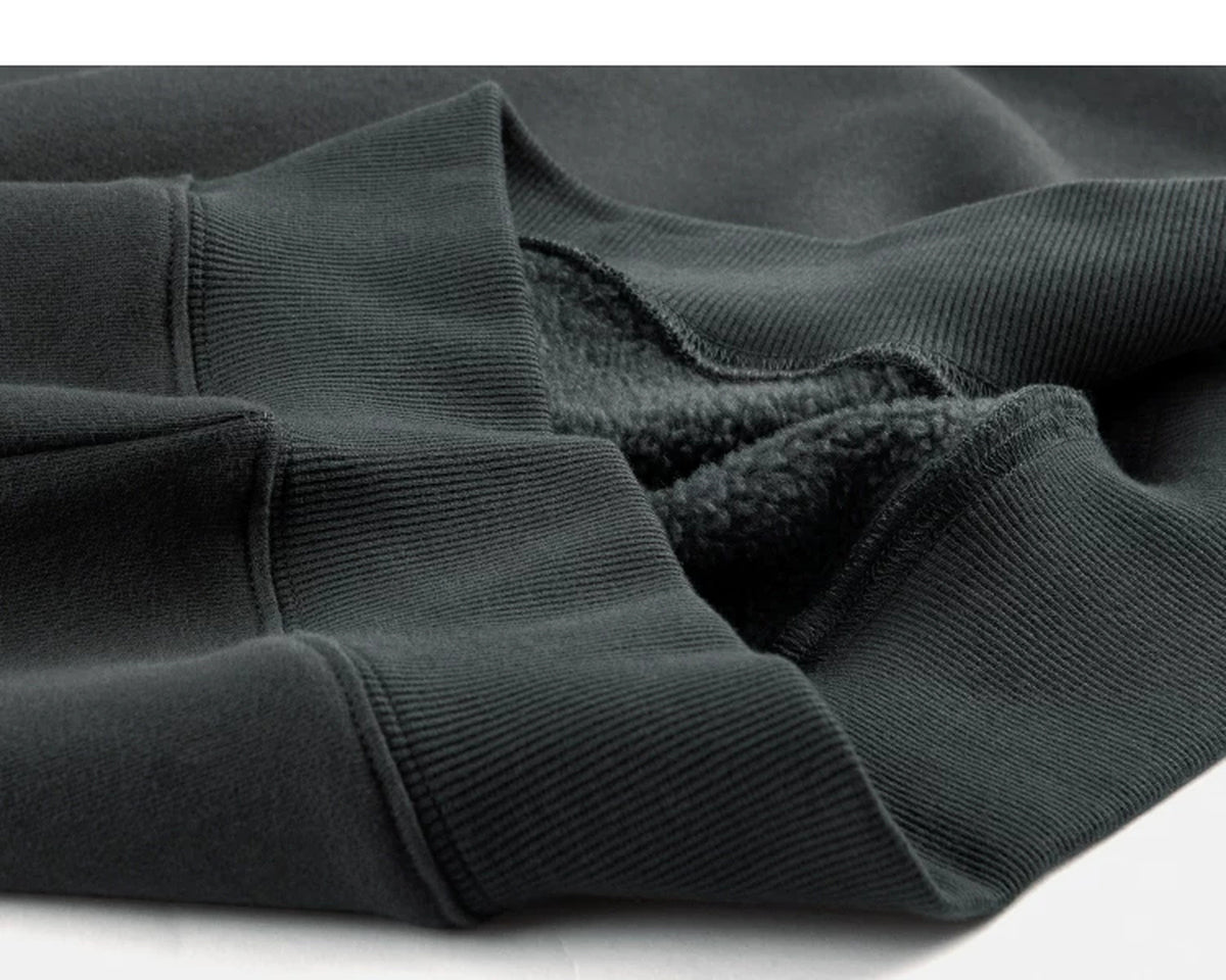 IDLT sweatshirt, dark green ribbed hem.
