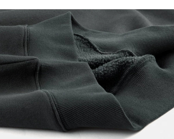 IDLT sweatshirt, dark green ribbed hem.