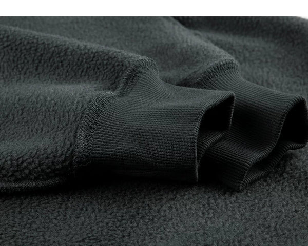 IDLT sweatshirt, dark green fleece sleeve and cuff.