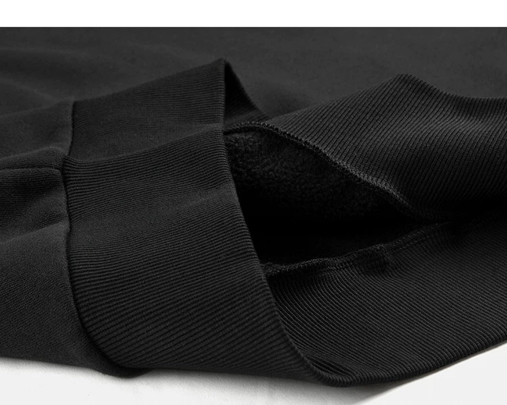 IDLT sweatshirt, black ribbed hem.