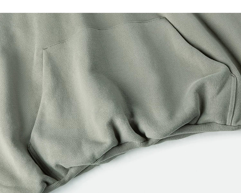 IDLT hoodie, sage green kangaroo pocket and hem.