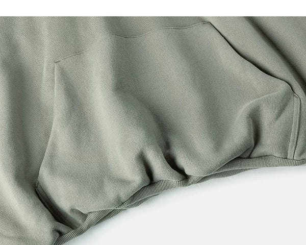IDLT hoodie, sage green kangaroo pocket and hem.