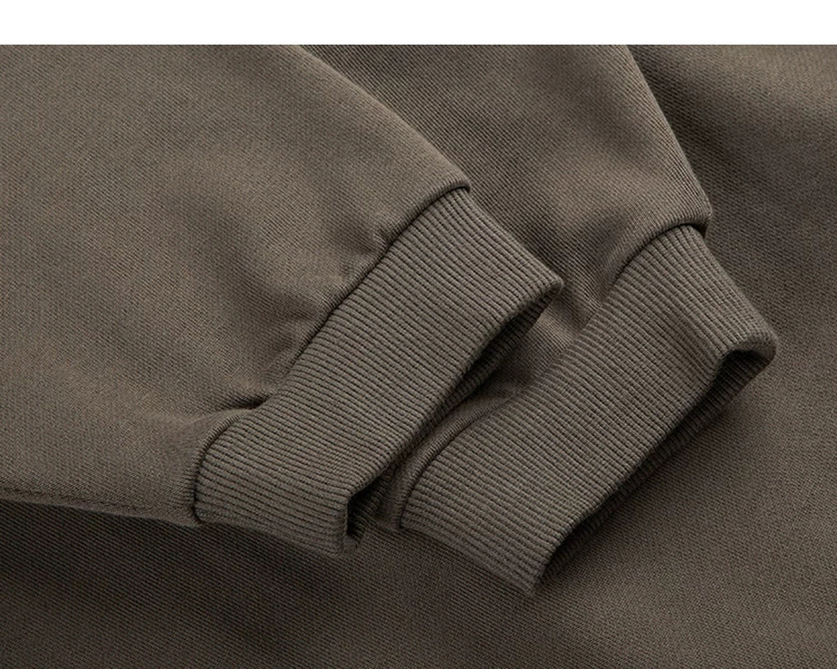 IDLT sweatshirt, brown ribbed cuffs.