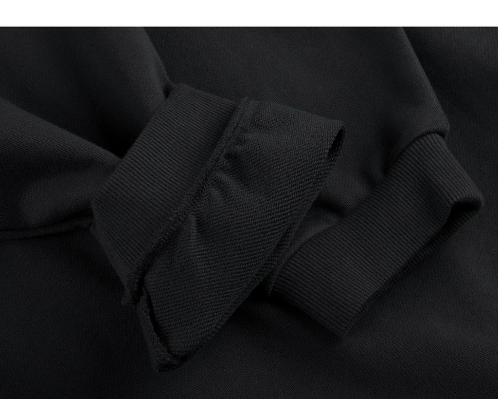 IDLT sweatshirt, black ribbed cuffs.