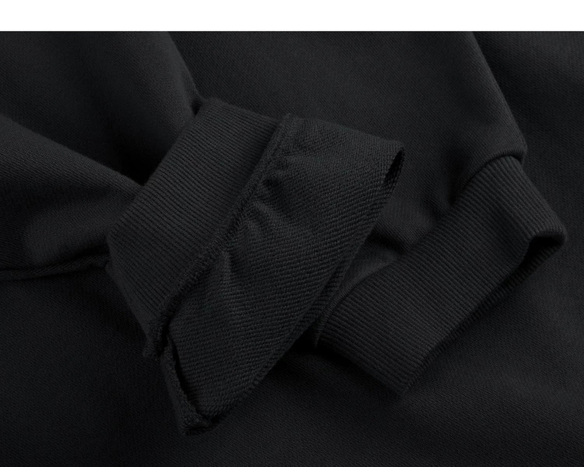 IDLT sweatshirt, black ribbed cuffs.