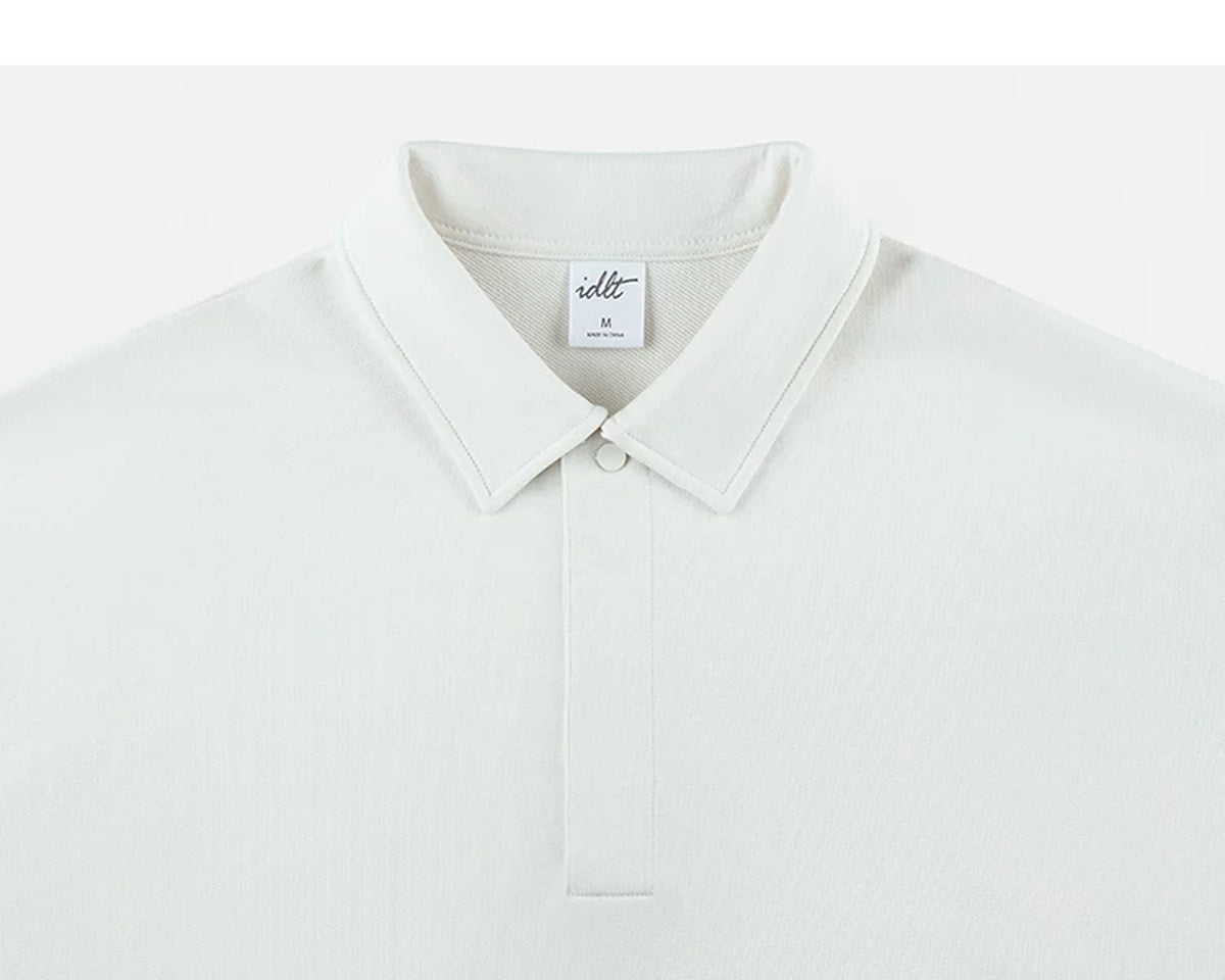 IDLT polo sweatshirt, white collar and concealed placket.
