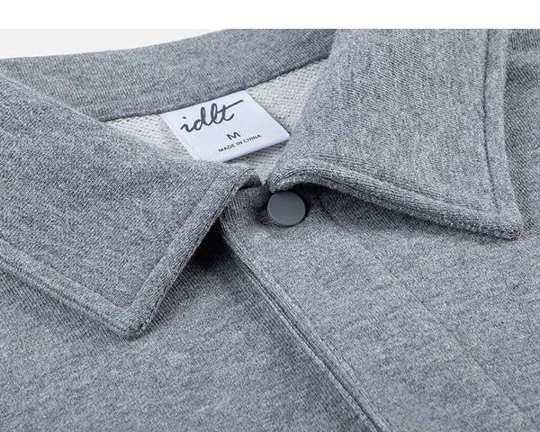 IDLT polo sweatshirt, heather gray collar and snap button.