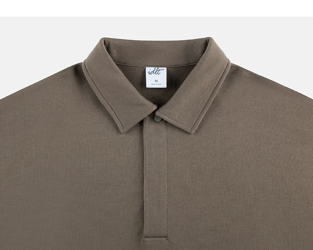 IDLT polo sweatshirt, brown collar and concealed placket.