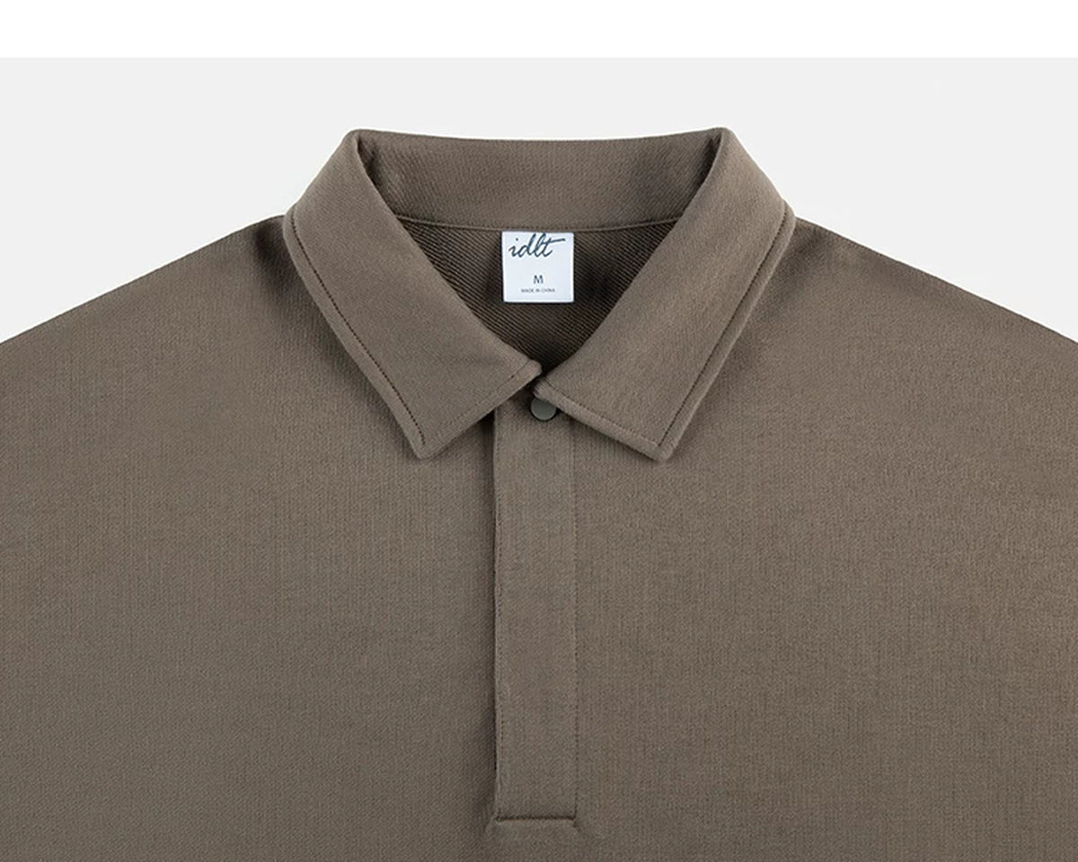 IDLT polo sweatshirt, brown collar and concealed placket.