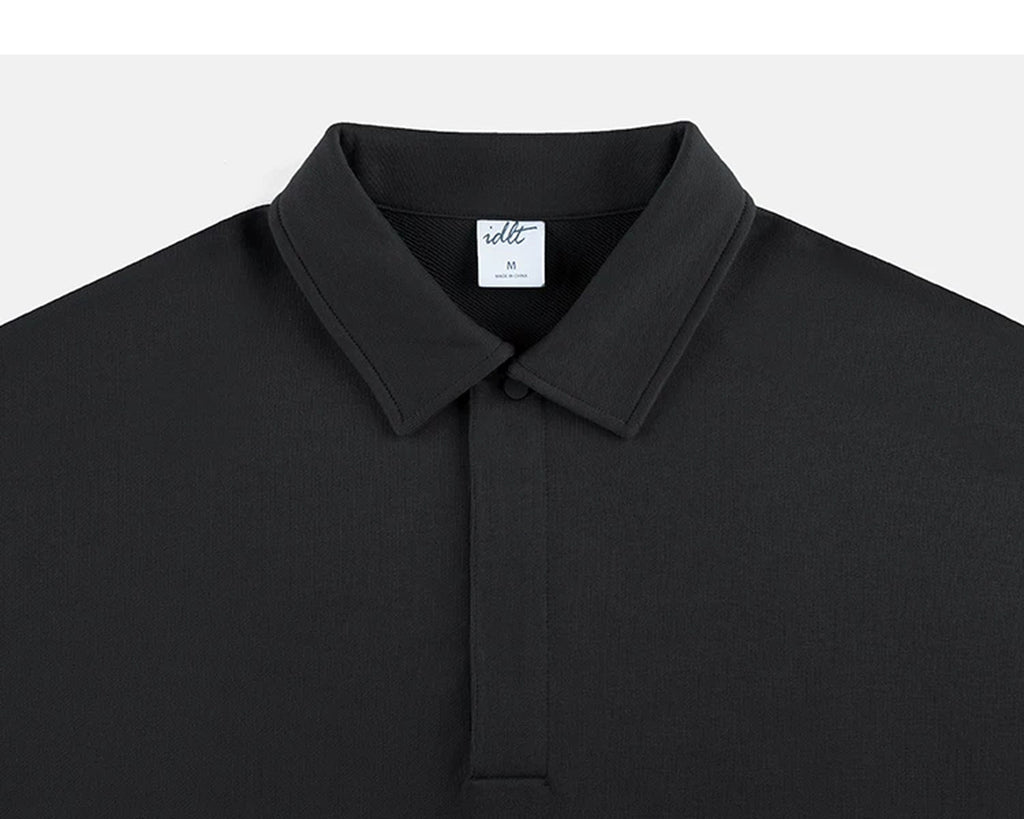 IDLT polo sweatshirt, black collar and concealed placket.